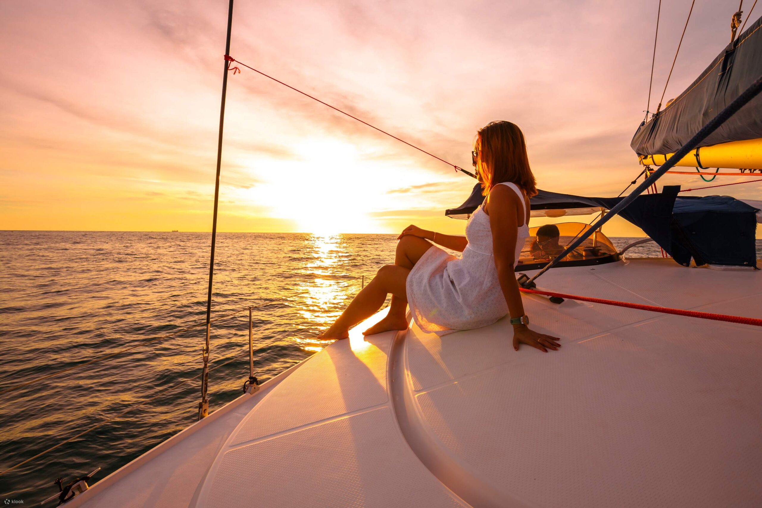 Romantic night sailing in Barcelona. Sunset sailboat cruise